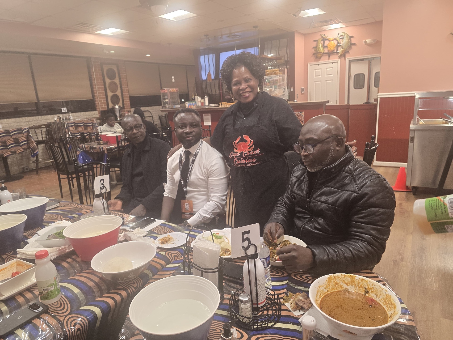 Around the table — peanut soup & jollof